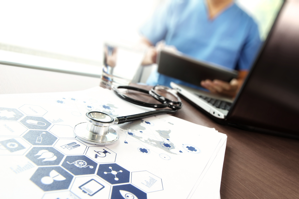 Doctor working with  laptop computer in medical workspace office and medical network media diagram as concept