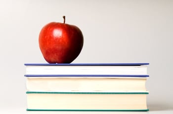 apple on a pile of books